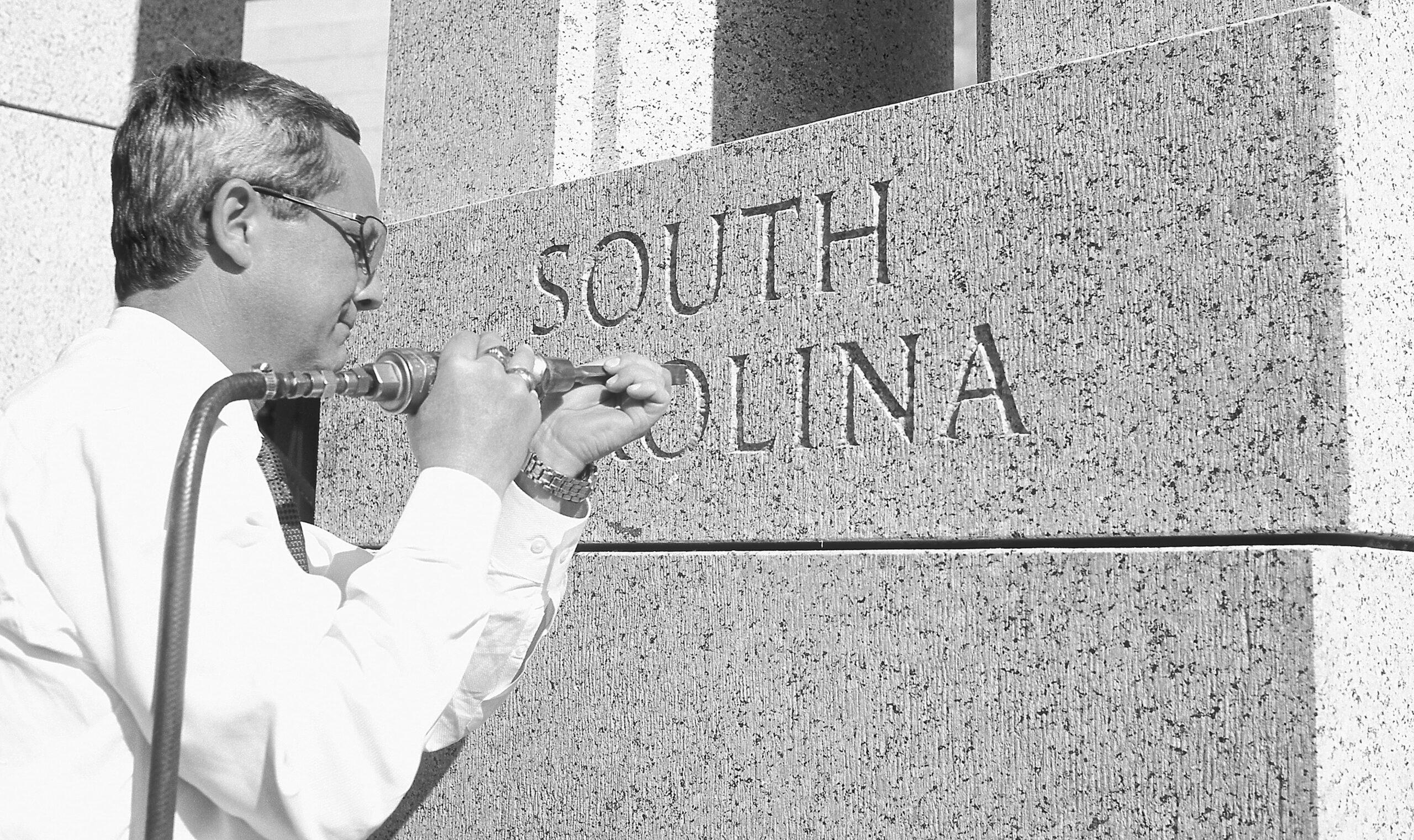 A Man Engraving South Carolina into the WWII Memorial